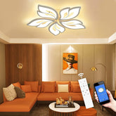 Modern living room with orange sectional sofa, decorative pillows, and a ceiling light fixture.
